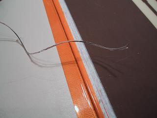 Cut edge of the flat CPA, with cut whisker